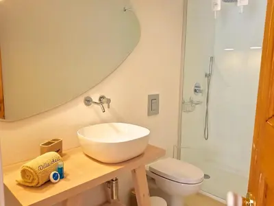 a bathroom with a sink and a toilet and a shower at Villa Azul - Clever Details, Luxury villa, private pool, access to a club with tennis court, playground, communal pools in Vilamoura