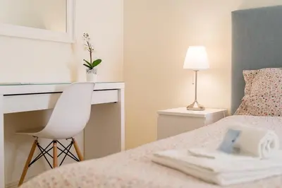 a white bathroom with a shower and a sink at AL - R&R Vilamoura Flat, City Center in Vilamoura