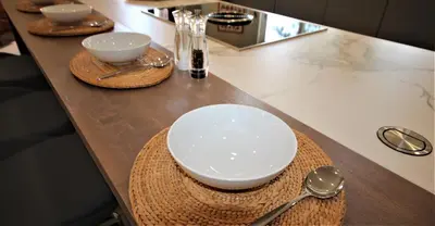 a table with plates and bowls and spoons on it at Casa Roma in Almancil