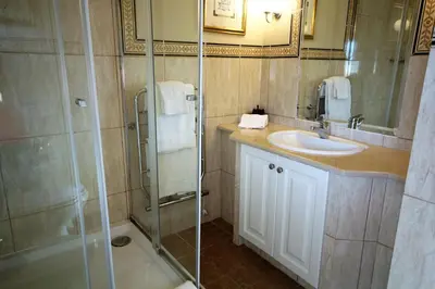 a bathroom with a shower and a sink at Casa Roma in Almancil