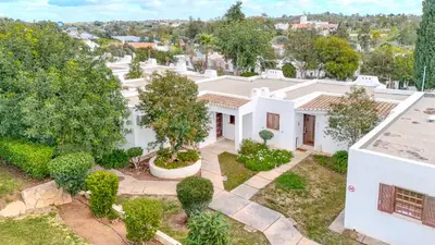 an aerial view of a white house with trees at T2 Casa Albufeira - Pool & Sun Terrace in Albufeira