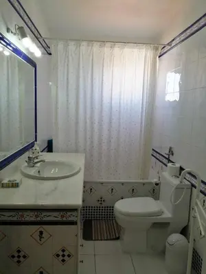 a bathroom with a toilet and a sink and a tub at Oura Villa V5 in Albufeira