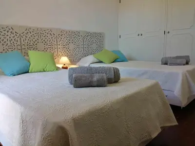 two beds with pillows on them in a room at Oura Villa V5 in Albufeira