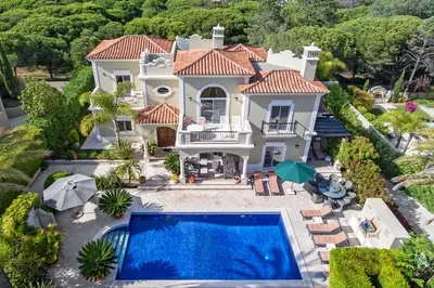 an aerial view of a house with a swimming pool at Villa Maureena - Quinta do Mar in Almancil