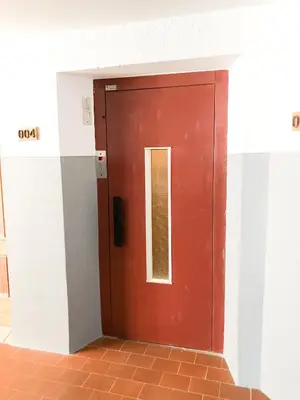 a red door with a window in a building at Vilamoura Marina Apartment with swimming pool in Vilamoura