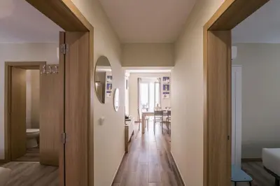 a hallway leading to a living room and a dining room at LovelyStay - Sweet Escape I - Terrace in Quarteira