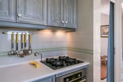 a kitchen with a stove and a counter top at LovelyStay - Two Bedroom Duplex at Vilamoura Marina in Vilamoura