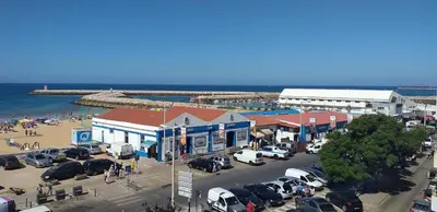 an aerial view of a parking lot next to the ocean at T2 Gaveto- Frente Mar, Wifi, Aconchegante & Familiar in Quarteira
