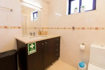 a bathroom with a sink and a mirror and a toilet at #005 Foxy B by Home Holidays in Albufeira