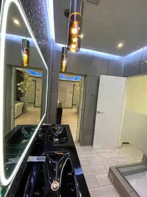 a kitchen with a black stove in a room at AL MMaria in Faro