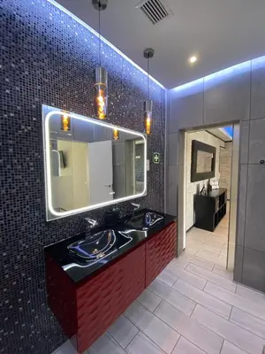 a bathroom with a sink and a mirror at AL MMaria in Faro