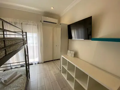 a dorm room with a bunk bed and a bunk bed at AL MMaria in Faro