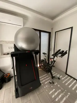 a room with a gym with a exercise bike at AL MMaria in Faro