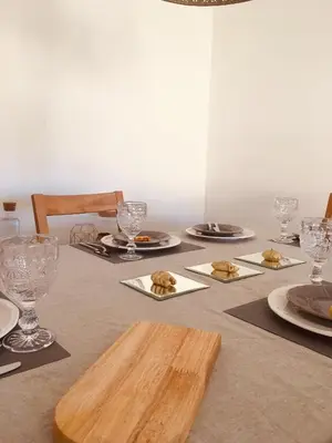 a table with plates of food and glasses on it at Dream House - Condominio com piscina aquecida e propriedade com 5 bicicletas incluindo 1 eletrica in Albufeira
