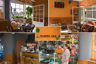 a man standing behind a counter in a restaurant at O Apartamento A Ramos Palmeira Galé Está inserido num Condomínio com PISCINA, Fica apenas a 250 Metros da Praia da Galé - Apartamento com Ar Condicionado na Sala, Smart TV com Prime Vídeo e Cozinha Completa in Albufeira