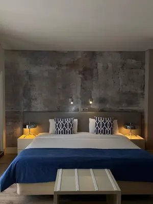 a hotel room with a bed and a window at Aqua Ria Boutique Hotel in Faro