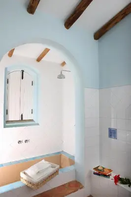 a bathroom with a tub and a mirror at Monte das Cortelhas in Guia