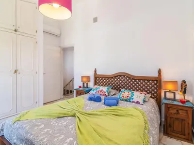 a bedroom with a large bed and two lamps at Holiday Home Roberts by Interhome in Albufeira