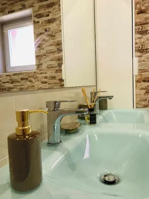 a bathroom sink with a faucet and a mirror at Golf Mar Village By Vilamoura Sun- Vista Golfe in Vilamoura