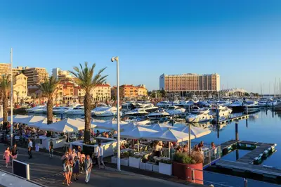 a marina with a bunch of boats in the water at Vilamoura Center - Near Marina By Vilamoura Sun in Quarteira