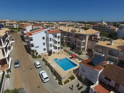 an aerial view of a city with a swimming pool at Apartamento - 2 a 4 Pessoas- Piscina in Olhos de Água