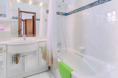 a white bathroom with a tub and a sink and a shower at Villa Antao in Guia