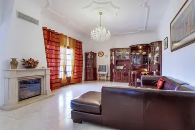 a living room with a couch and a fireplace at Villa Antao in Guia