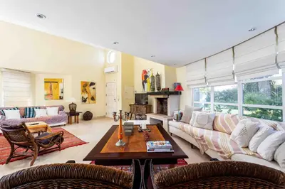 a living room with a couch and a table at Luxury Villa 6 bedrooms with private pool in Vilamoura