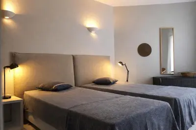 a bedroom with two beds with blue sheets at Stylish Center Apartment Vilamoura in Vilamoura
