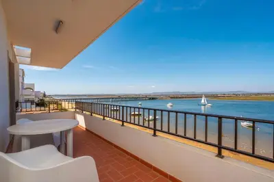 a balcony with a view of the water at Sundance Beach House in Faro