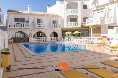 an alley in positano with colorful houses at #007 Foxy W by Home Holidays in Albufeira