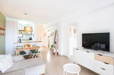 a living room with a couch and a tv at #006 Foxy D by Home Holidays in Albufeira