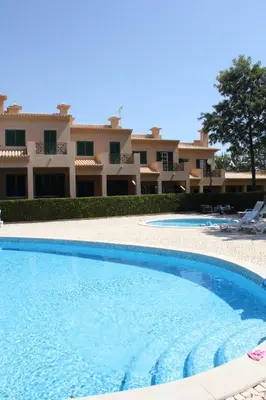 a large swimming pool in front of a building at Villa V2 X in Albufeira