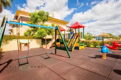 a playground with a slide and a slideintend at GREICE HOMES 2 BEDROOM LUXURY APARTMENT VICTORIA BOULEVARD in Vilamoura