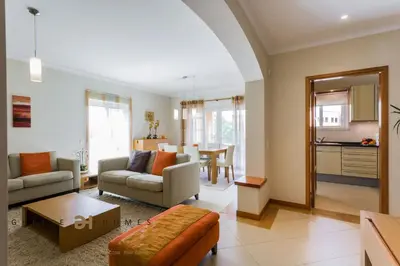 a living room with a couch and a table at GREICE HOMES 2 BEDROOM LUXURY APARTMENT VICTORIA BOULEVARD in Vilamoura
