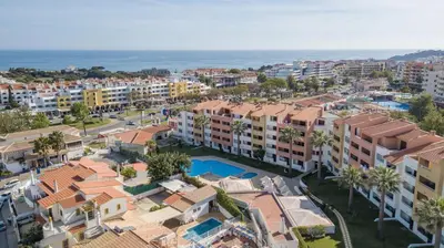 an aerial view of a city with buildings and the ocean at Love Albufeira - Center, walk to the beach, Old Town, Oura Strip, top location in Albufeira