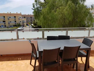 a table and chairs sitting on a balcony at Forte Beach- Albufeira in Albufeira