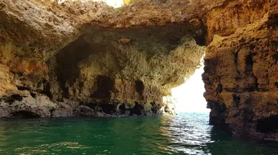 a cave in the water next to the ocean at Albufeira, with terrace, see views, 5 min to beach (21) in Albufeira