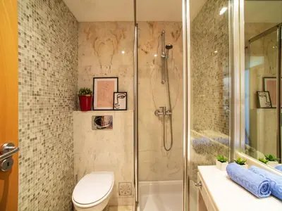 a bathroom with a shower with a toilet and a sink at Apartment Vilas Mouriscas by Interhome in Vilamoura