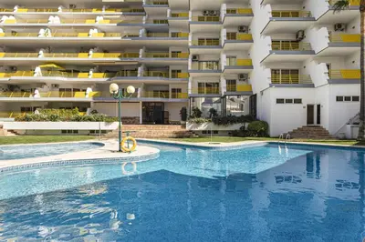 a swimming pool in front of a large apartment building at Varandas do Sul - Near Vilamoura Marina in Vilamoura