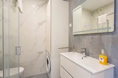 a bathroom with a sink and a toilet and a shower at Marina View Apartment By VilamouraSun in Vilamoura