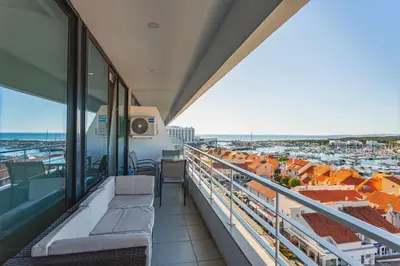 a balcony with a view of a city at Marina View Apartment By VilamouraSun in Vilamoura