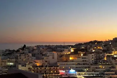 a view of a city at night at Albufeira, One step to the beach (13) in Albufeira