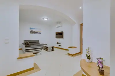 a living room with a couch and a table at Victoria Boulevard - Vasco da Gama - Vilamoura in Vilamoura