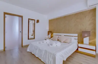 a bedroom with a large white bed with two pillows at Primula - Wonderful view - Vilamoura Marina in Vilamoura