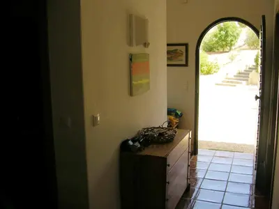 a room with a dresser and an open door at Welcoming House in Albufeira in Albufeira