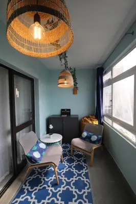 a room with two chairs and a table and a window at Apartamento T0 Albufeira perto do Centro in Albufeira
