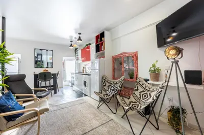 a living room with chairs and a table at Townhouse N7 - Albufeira in Albufeira