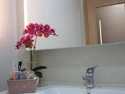a bathroom with a shower and a toilet and a sink at Casa Mimi in Faro