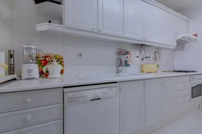 a white bathroom with a sink and a toilet at Pinhal do Golfe - 2 Bedrooms - Vilamoura in Vilamoura